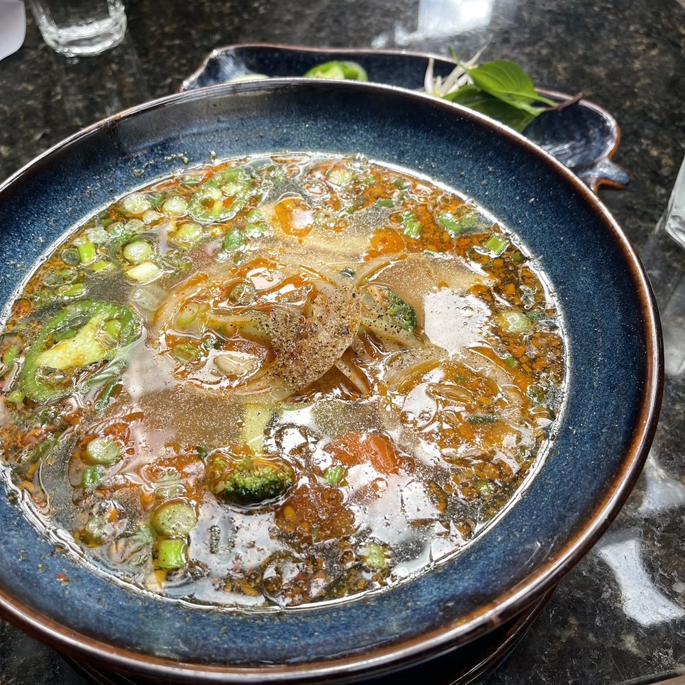 Maria's pho creation: half chicken broth, half lemongrass soup, shrimp, chicken, vegetables and noodles. Maria's pho creation: half chicken broth, half lemongrass soup, shrimp, chicken, vegetables and noodles.
