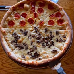 Pizza with olive oil- garlic base, half mushroom, half pepperoni. Amazing! Pizza with olive oil- garlic base, half mushroom, half pepperoni. Amazing!