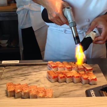 Miku - Blowtorching the Oshi Salmon Rolls - Japanese Near Me - Vancouver, British Columbia