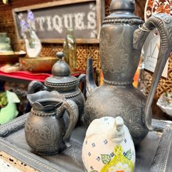 America's Antique Mall - An elegant vintage metal tea and coffee set with intricate floral details--just one of the distinctive treasures at AAM Melbourne.