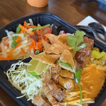 CoCoCurry - Khao Soi curry, crispy pork, egg noodles, papaya salad. - Thai Near Me - San Diego, California CoCoCurry - Khao Soi curry, crispy pork, egg noodles, papaya salad. - Thai Near Me - San Diego, California