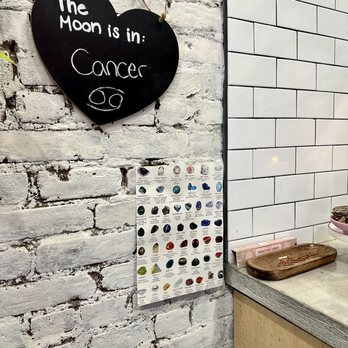 Serotonin Smoothies - a kitchen with a white brick wall - Juice Bars & Smoothies Near Me - New York, New York