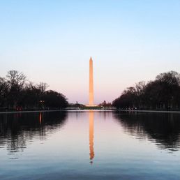 At the Lincoln Memorial Reflecting Pool facing the Washington Monument as the sun sets.