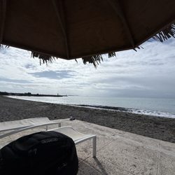 Hilton Ponce Golf & Casino Resort - The concrete slab beach front, 8 chairs that's it!