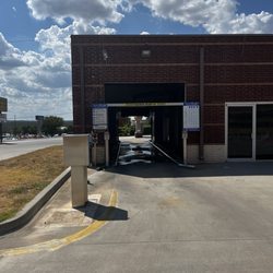 Kwik Kar Lube & Tune - Broken tire guide on left side of entrance.  Destroyed tire and damaged rim.