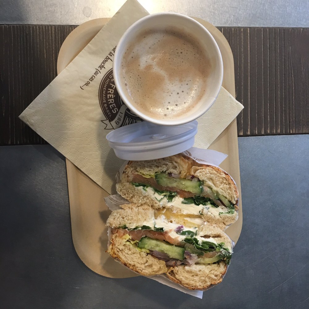 Bagelstein - Cheese bagel with salmon, cream cheese, cucumbers, arugula, and onion. Side of coffee. - Bagels Near Me - Paris, 75 Bagelstein - Cheese bagel with salmon, cream cheese, cucumbers, arugula, and onion. Side of coffee. - Bagels Near Me - Paris, 75