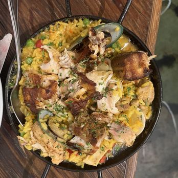 Hola - Paella - good presentation, temperature, seafood amount, while lacking spice, is very soupy, and scattered grinds when chewing. - Tapas Bars Near Me - San Antonio, Texas