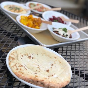 FIYA - a plate of food on a table - Mediterranean Near Me - Chicago, Illinois FIYA - a plate of food on a table - Mediterranean Near Me - Chicago, Illinois