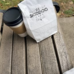 Bagel and latte.  Oat Milk