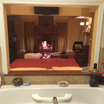 Brampton Bed and Breakfast Inn - View of the fireplace and bed from the indoor jetted tub in the Mulberry cottage - Bed & Breakfast Near Me - Chestertown, Maryland Brampton Bed and Breakfast Inn - View of the fireplace and bed from the indoor jetted tub in the Mulberry cottage - Bed & Breakfast Near Me - Chestertown, Maryland