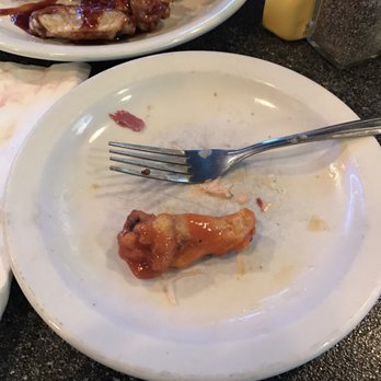 RJ's Pub - Showing how tiny wing is compared to fork - Sports Bars Near Me - Rochester Hills, Michigan RJ's Pub - Showing how tiny wing is compared to fork - Sports Bars Near Me - Rochester Hills, Michigan