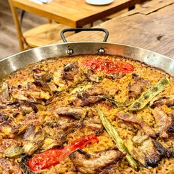 Paella valenciana with chicken and pork