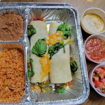 Chuy's - Vegetarian enchilada. Few additional salsas on the side. - Tex-Mex Near Me - Austin, Texas