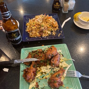Bamboo City - two plates of food and a bottle of beer - Chinese Near Me - Grand Junction, Colorado