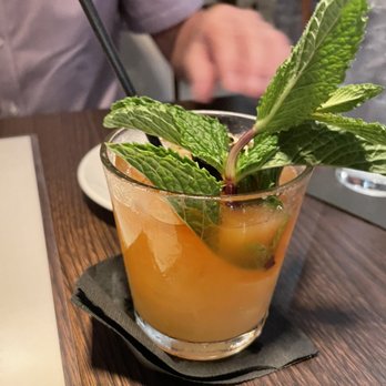 Prime 239 Steakhouse - a close up of a drink with a mint leaf garnish - Steakhouses Near Me - Cape Coral, Florida Prime 239 Steakhouse - a close up of a drink with a mint leaf garnish - Steakhouses Near Me - Cape Coral, Florida