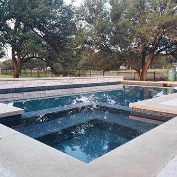 Pond Springs Custom Pools - Hot tub on same level as the pool looks sleek and contemporary. - Pool & Hot Tub Service Near Me - Round Rock, Texas Pond Springs Custom Pools - Hot tub on same level as the pool looks sleek and contemporary. - Pool & Hot Tub Service Near Me - Round Rock, Texas