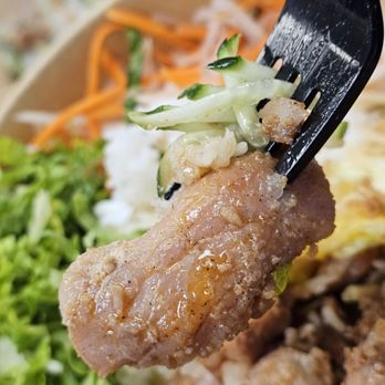 It's Pho Time - A fork holding a piece of the Glazed Pork from the Glazed Pork Dish. - Vietnamese Near Me - Roanoke, Virginia It's Pho Time - A fork holding a piece of the Glazed Pork from the Glazed Pork Dish. - Vietnamese Near Me - Roanoke, Virginia