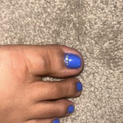 Classy Nails and Spa - Bad polish and pearls not centered.