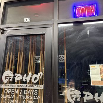 Pho 77 - OPEN sign lit up nice and bright while the inside is dark as my mood after seeing this place was closed already. - Vietnamese Near Me - Rialto, California