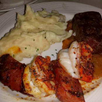 Eddie Merlot's - The New Orleans mixed grill with filet, chorizo, shrimp, bacon gravy and garlic mashed potatoes. - Steakhouses Near Me - Cincinnati, Ohio