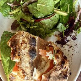 Mozzarella, burrata and tomato sandwich with fresh baked sourdough.