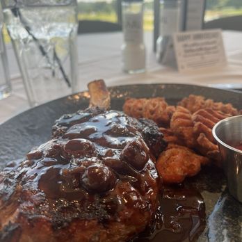 The Pearl - Grilled bone in pork chop with cherry Demi glaze and sweet potato fries - Desserts Near Me - Clinton, Tennessee The Pearl - Grilled bone in pork chop with cherry Demi glaze and sweet potato fries - Desserts Near Me - Clinton, Tennessee