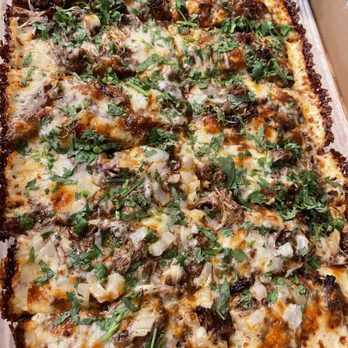 Xtra Cheese - Birria pizza has cilantro and onions and is served with consomé to dip (definitely improved the pizza). - Pizza Near Me - Whittier, California Xtra Cheese - Birria pizza has cilantro and onions and is served with consomé to dip (definitely improved the pizza). - Pizza Near Me - Whittier, California