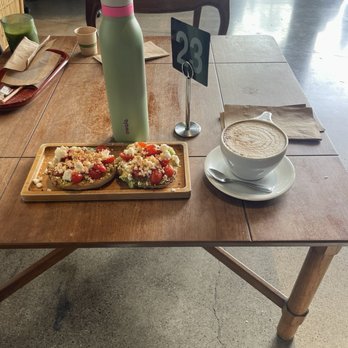 Vigilante Coffee - the goat on an everything bagel and a vanilla latte w oat milk - Coffee & Tea Near Me - Oceanside, California Vigilante Coffee - the goat on an everything bagel and a vanilla latte w oat milk - Coffee & Tea Near Me - Oceanside, California