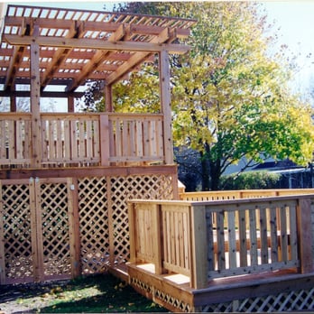 Fenx Construction - a deck with a pergolated trellis - General Contractors Near Me