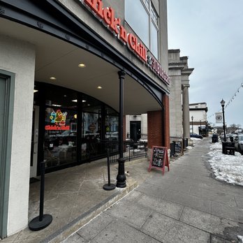 Chick'n Chill - Exterior - The image shows the storefront of a Chick-fil-A restaurant on a city sidewalk, with snow and ice on the ground and outdoor signage. - Desserts Near Me - Rutherford, New Jersey
