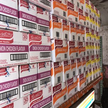 Rivera Produce - a man standing in front of a large stack of boxes - International Grocery Near Me - Los Angeles, California Rivera Produce - a man standing in front of a large stack of boxes - International Grocery Near Me - Los Angeles, California