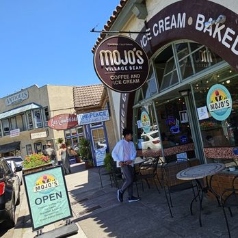 Mojo's Village Cafe - a man standing in front of a store - Coffee & Tea Near Me - Cambria, California