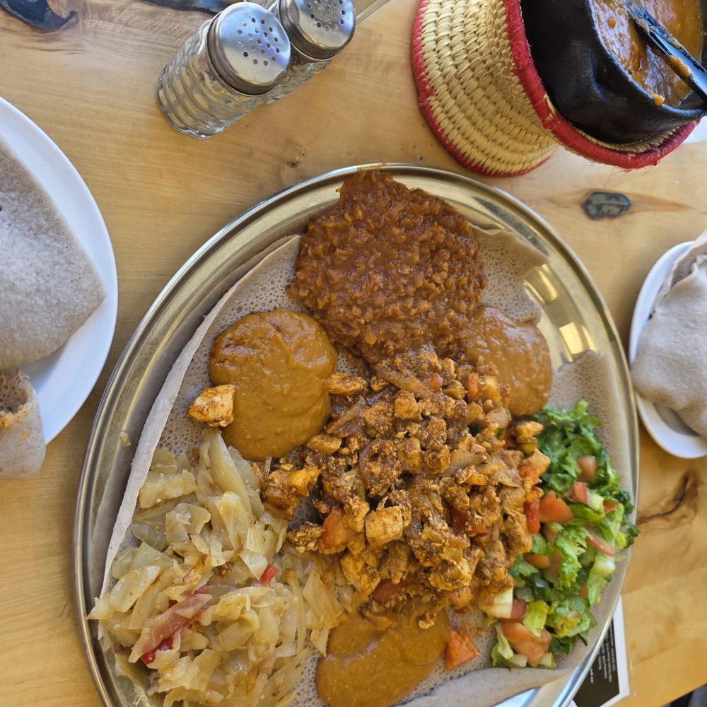 Keren Restaurant - Tbisi Chicken and Chickpea stew on enjera bread - Ethiopian Near Me - Washington, DC, District of Columbia Keren Restaurant - Tbisi Chicken and Chickpea stew on enjera bread - Ethiopian Near Me - Washington, DC, District of Columbia