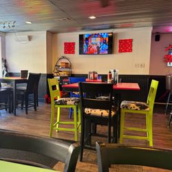 Pandamoneum Restaurant & Bar - Odd interior with a shelf of random kids games