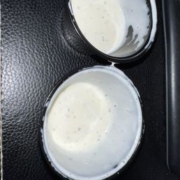 Two containers of ranch dressing for 24 wings. These aren't even 1/4 full. Two containers of ranch dressing for 24 wings. These aren't even 1/4 full.