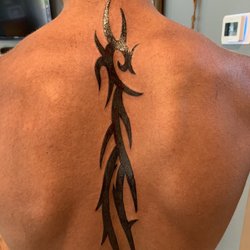 Untamed Tattoos and Piercings - Tribal art tattoo.