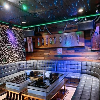 K-ONE Music KTV - a room with a couch and a coffee table - Karaoke Near Me - Richmond, California K-ONE Music KTV - a room with a couch and a coffee table - Karaoke Near Me - Richmond, California