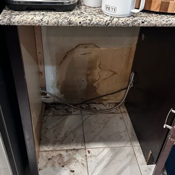 Brian B. Quick Plumbing - Cabinet opening showing water damage - Plumbing Near Me - Beltsville, Maryland