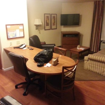 Candlewood Suites Bloomington-Normal - Part of the kitchen and the couch/TV area. - Hotels Near Me - Normal, Illinois Candlewood Suites Bloomington-Normal - Part of the kitchen and the couch/TV area. - Hotels Near Me - Normal, Illinois