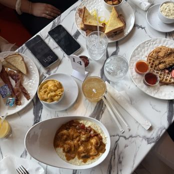Bird & Batter - Table Spread with Shrimp & Grits, Chicken & Waffle,  B&B Breakfast,  Bodega Sandwich - Breakfast & Brunch Near Me - Atlanta, Georgia