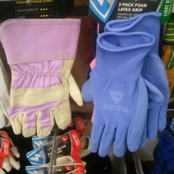 Tractor Supply - TSC carries gloves, shirts, and boots in that "tween" female size of "not a child but not a tall adult." Great place to "Git 'er done!" -E