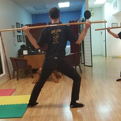 Qigong exercise with a staff