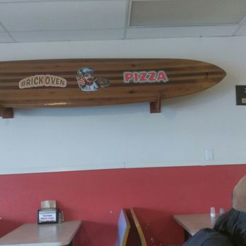 Toppers Pizza - a surfboard mounted on the wall - Pizza Near Me - Mulberry, Florida Toppers Pizza - a surfboard mounted on the wall - Pizza Near Me - Mulberry, Florida