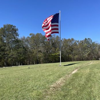Shady Grove Dude Ranch - This is the flag is Infront of the barn make sure to take a photo with the horse by the flag great pictures to have - Golf Near Me - Mentone, Alabama