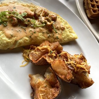 Basin Seafood & Spirits - Crawfish omelette with Basin's signature, breakfast potatoes, awesome! - Seafood Near Me - New Orleans, Louisiana