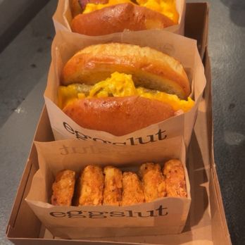Eggslut - Fairfax with bacon & another with turkey sausage paired with hash browns. - Breakfast & Brunch Near Me - Las Vegas, Nevada