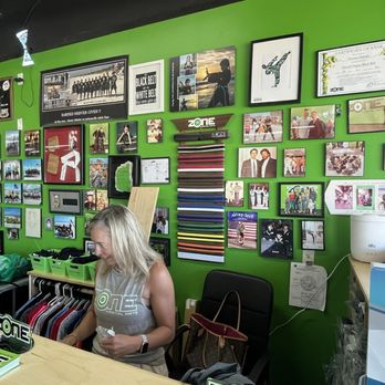 Zone Martial Arts - The front desk manned by Mrs. Melanie Ekholm - lots of photos and awards! - Karate Near Me - Jacksonville, Florida Zone Martial Arts - The front desk manned by Mrs. Melanie Ekholm - lots of photos and awards! - Karate Near Me - Jacksonville, Florida