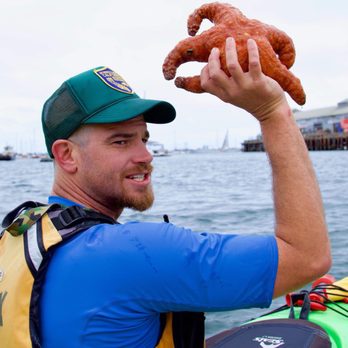 Monterey Bay Kayaks - Rob the Tour Guide with a starfish Photo Credit John D - Boating Near Me - Monterey, California Monterey Bay Kayaks - Rob the Tour Guide with a starfish Photo Credit John D - Boating Near Me - Monterey, California