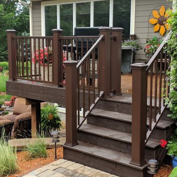 Aquatic Gardens & Landscaping - a deck with stairs leading to a patio - Landscaping Near Me - Mankato, Minnesota Aquatic Gardens & Landscaping - a deck with stairs leading to a patio - Landscaping Near Me - Mankato, Minnesota