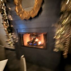 Inovasi - Sorry it's blurry, but we had a nice table in front of the fireplace